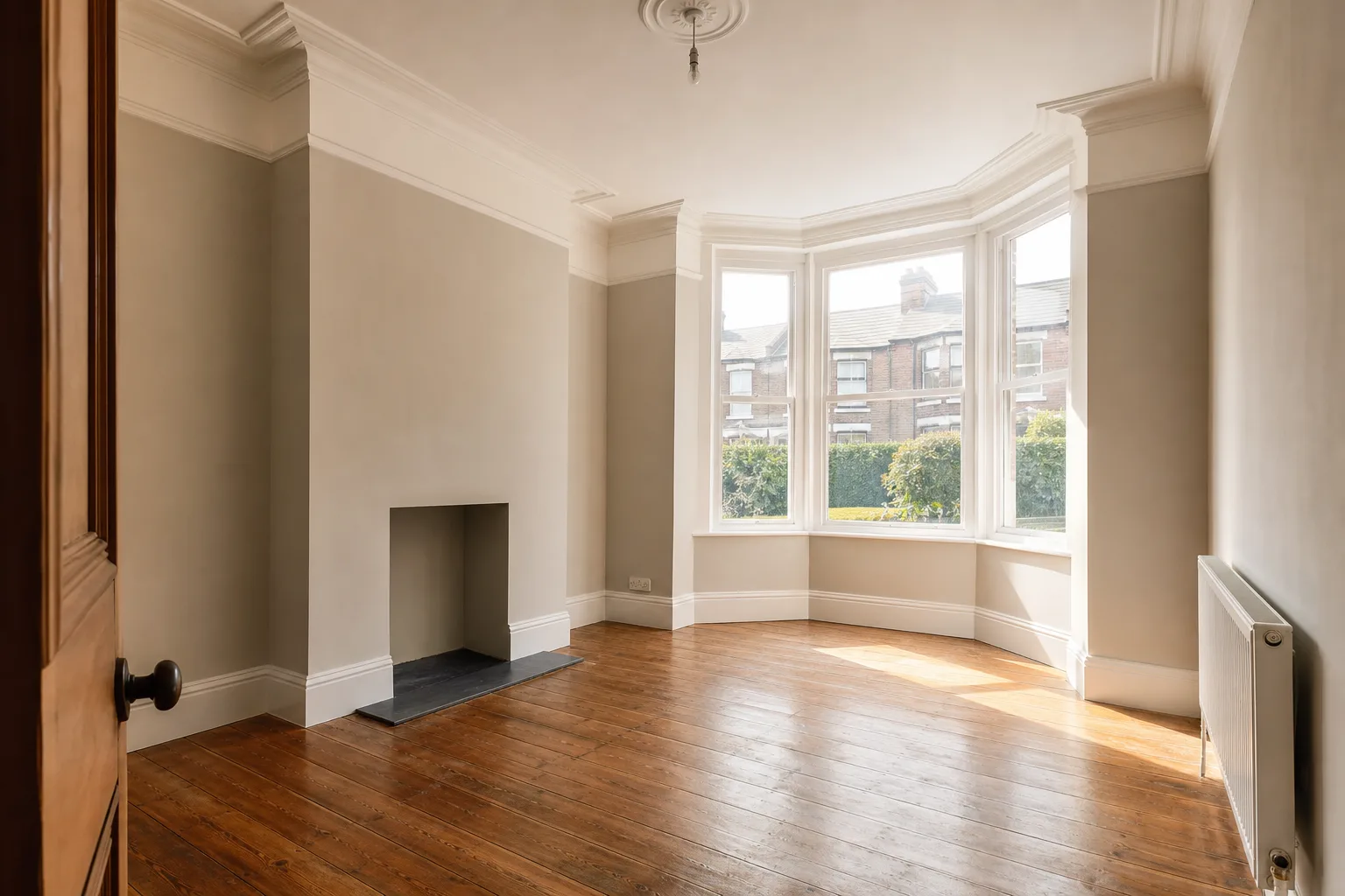 Bright, freshly cleared living room in a Huddersfield home